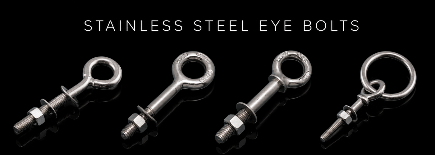 Stainless steel eye bolts and ring bolts on a black reflective background