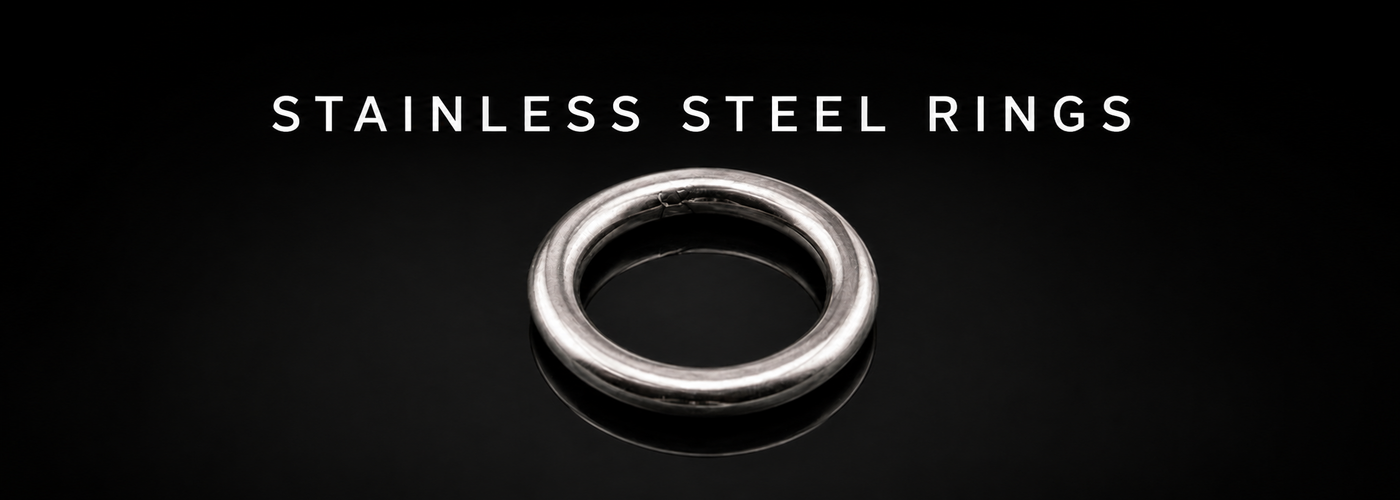 Welded stainless steel round ring on a black reflective background