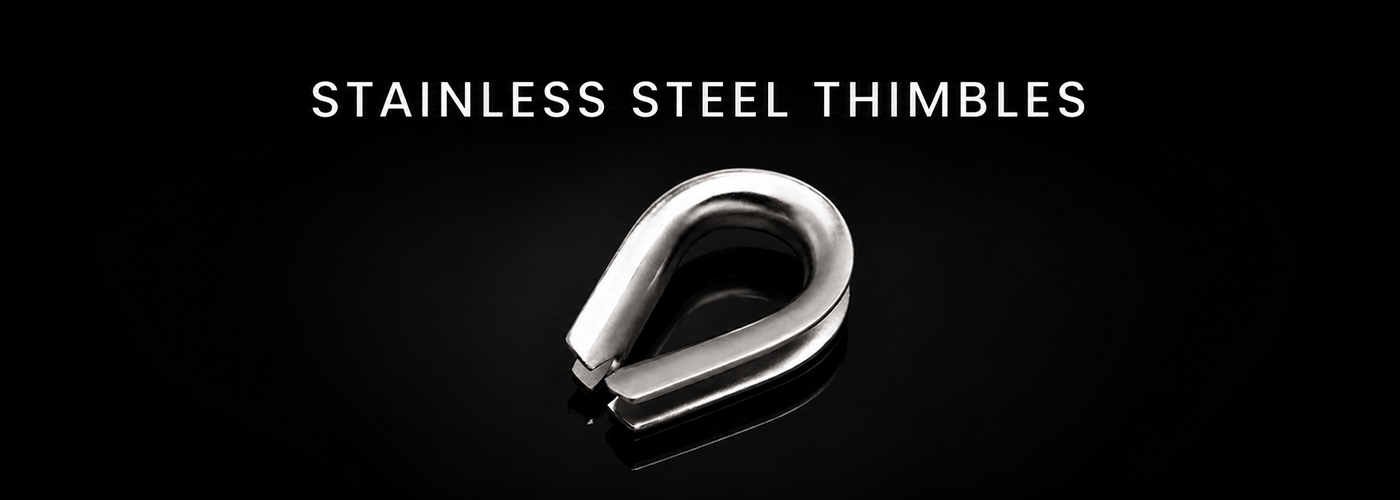 Stainless steel wire rope thimbles on a black reflective background
