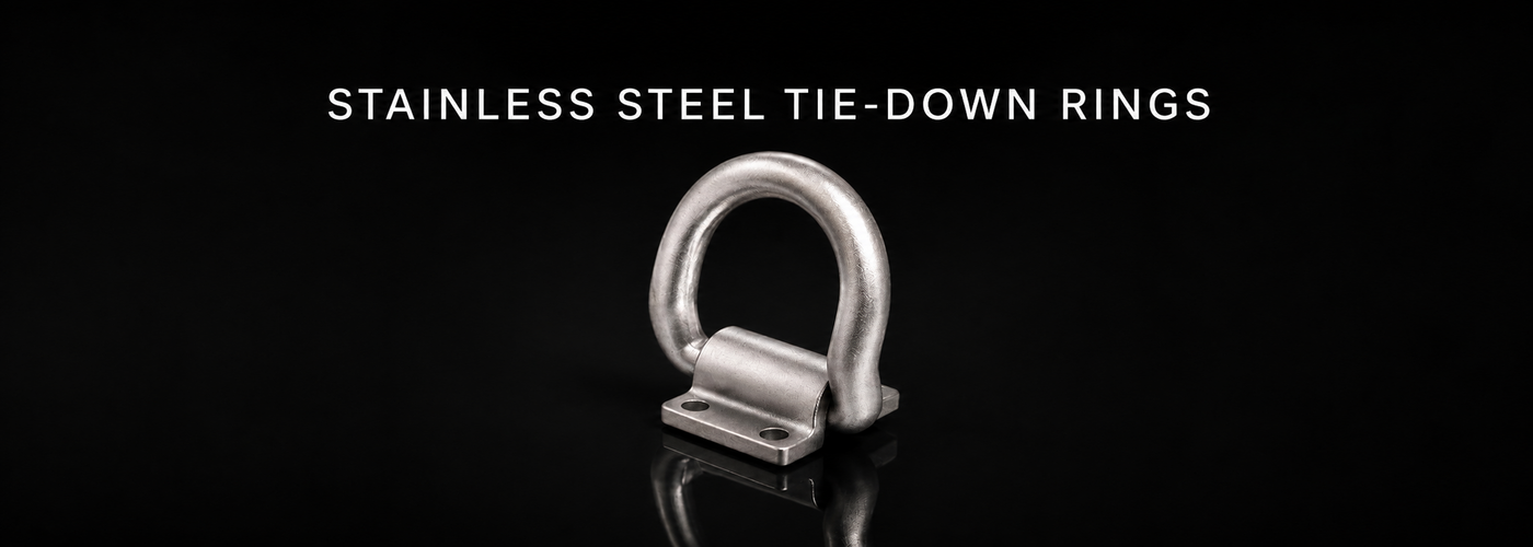Folding stainless steel tie-down ring on a black reflective background